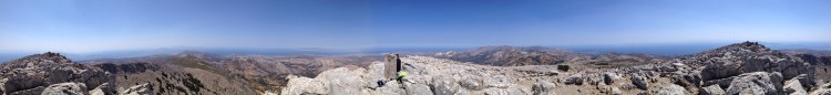 On the summit of Mount Zeus on Naxos. The islands of Paros, Little Cyclades, and Mykonos in the distance. 